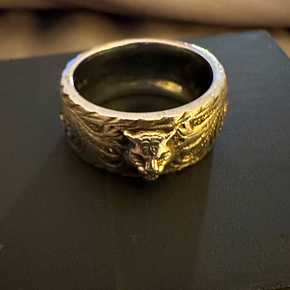 Thin silver ring with feline head